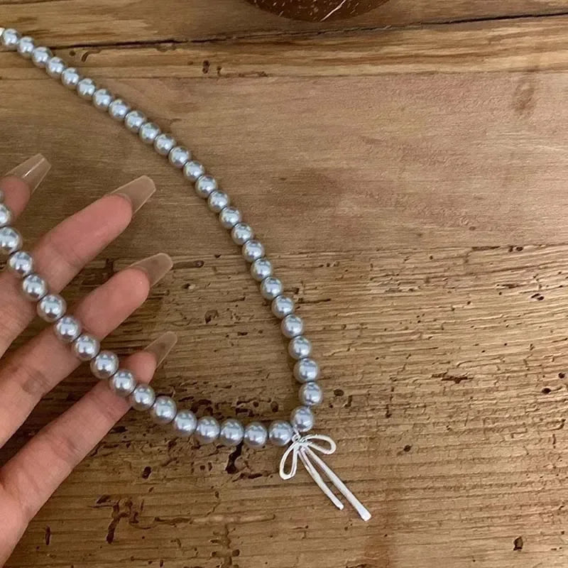 Metal Bowknot Pendant Imitation Pearl Necklace For Women Grey Color