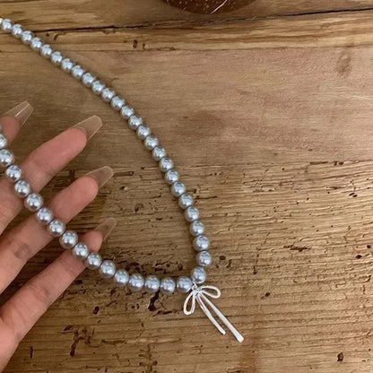 Metal Bowknot Pendant Imitation Pearl Necklace For Women Grey Color